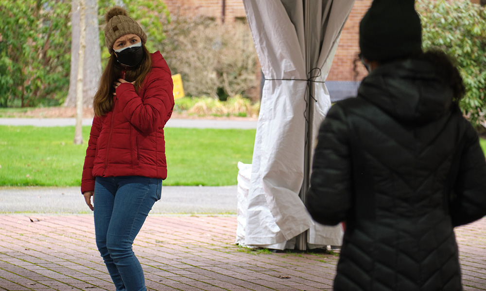 Two students rehearse opera under the tent in Red Square.