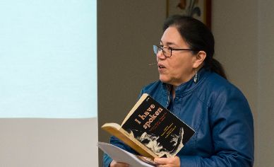 image-2018-03-12 Woman speaking into microphone