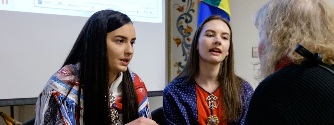 Mathilde Magga '20 (left) and Elle Sina Søerensen '20 speak during a panel event on Sámi National Day in the Scandinavian Cultural Center at PLU on Feb. 6. Both students are wearing their traditional Sámi garb.