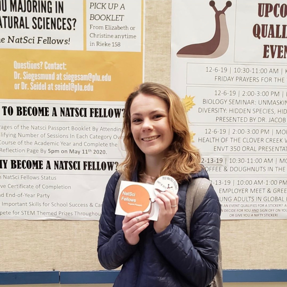 Student holding stickers