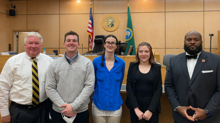 judges with their interns in the courtroom