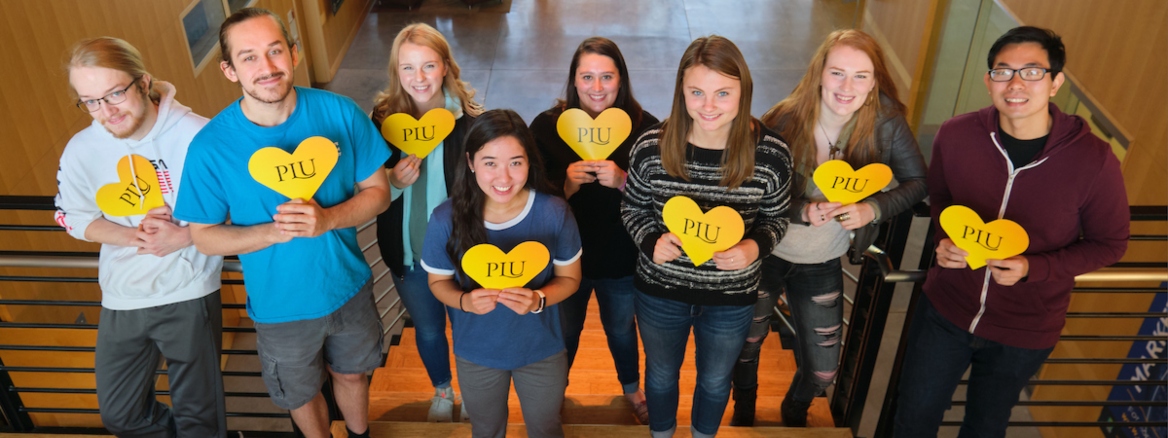 NSCI students who receive scholarships holding PLU hearts, Wednesday, Oct. 9, 2019 at PLU. (Photo/John Froschauer)