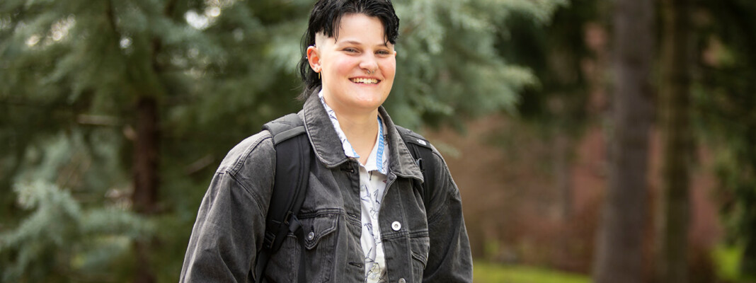 Allison in front of trees at PLU.