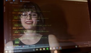 Emily Shane reflected in computer screen