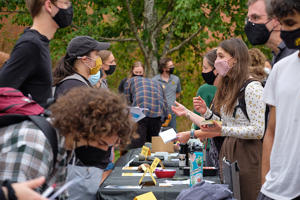 students talking with professors