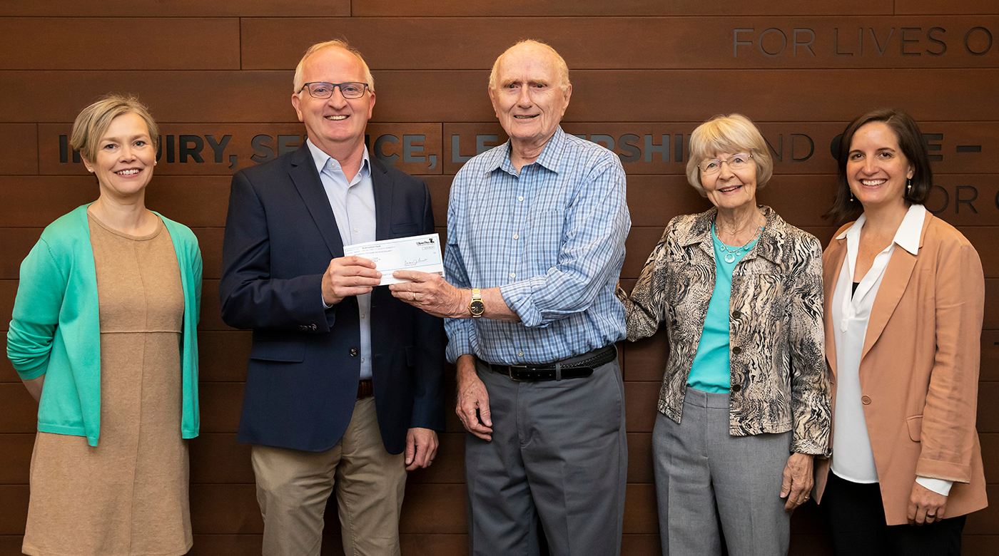 The Steens stand with Allan Belton, Sergia Hay, and Adela, Ramos.