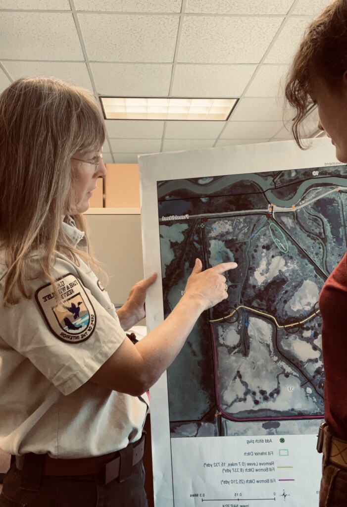 two women looking at a map