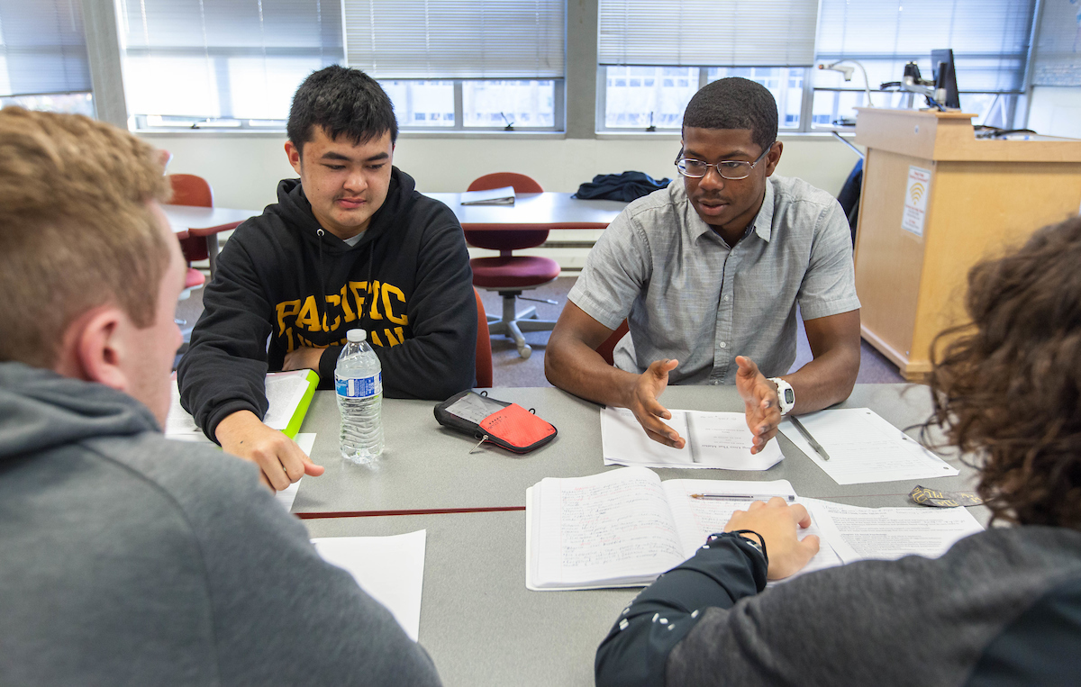 Students studying at a table.