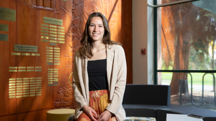 Jackie Lindstrom sitting in the Rieke Lobby.