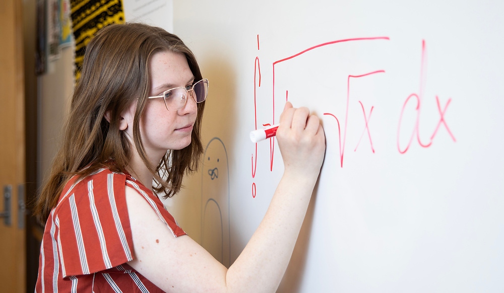 Lindsey Clakrk doing an equation on the whiteboard