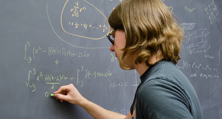 Matthew Helmer at a chalkboard