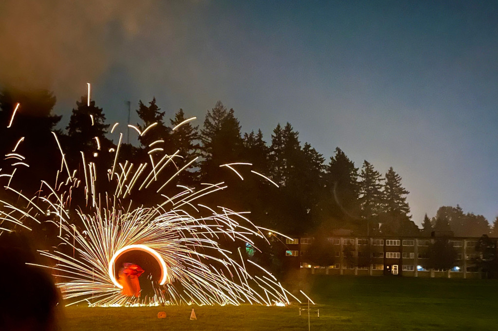 Professor Lytle swinging a fire circle
