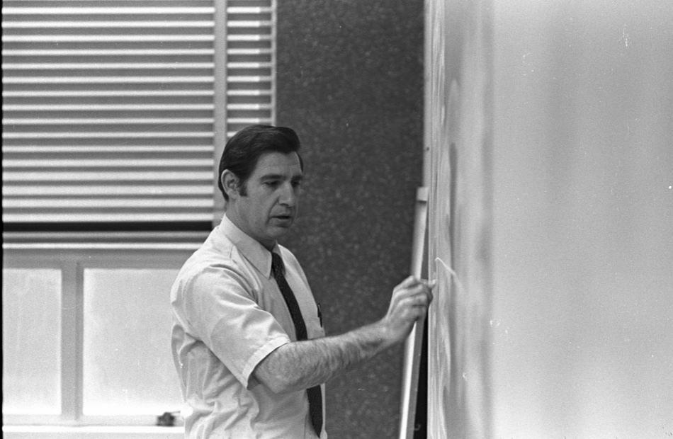 73-0302-08 Ken Batker at chalkboard