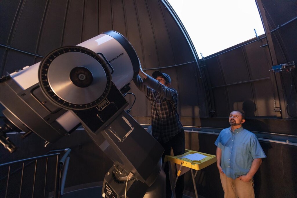 20230712_SB_Observatory-Summer-Research_145-medium Two men examining a large astronomical telescope.