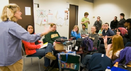 Professor Joanne Lisosky gives last minute instructions to students before they prepare to embark on a journey to Uganda. (Photo by Theodore Charles ’12)