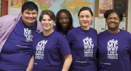 Women's Center students all wearing purple tee shirts