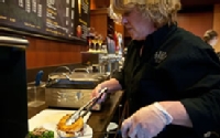 Angi Unger, of Dining and Culinary Services, prepares a fresh panini.