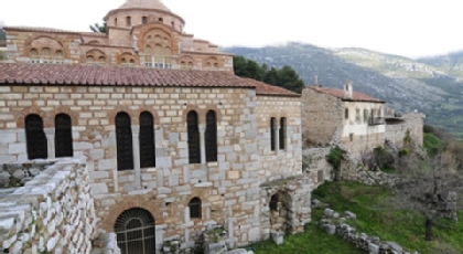 Old brick buildings on the side of a mountain