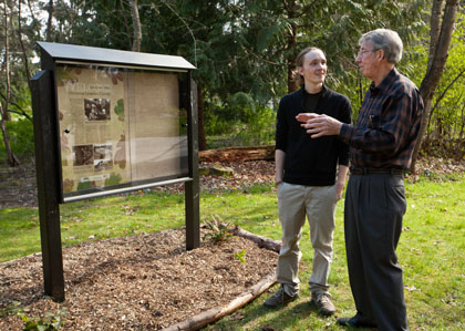 Reed Ojala-Barbour ’11, talks with Fred Tobiason, professor emeritus of chemistry, during the dedication of the Fred L. Tobiason Outdoor Learning Center at PLU on Monday, April 18, 2011.