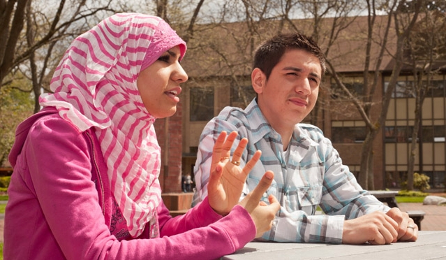 Bashair Alazadi ’13 and Carlos Sandoval ’13 look forward to talking about the perceptions and the realities with the Muslim club. (Photo by John Froschauer)