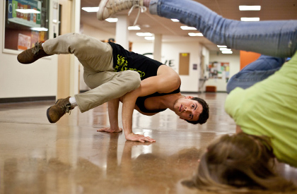 Colin Roth ’11, who started PLU’s Breakdancing Ministries, works on some moves with a friend. (Photo by John Froschauer)