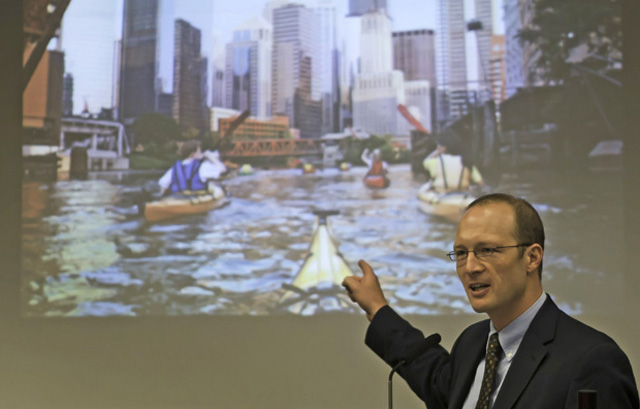 Featured speaker Benjamin Stewart, a professor and chair at the Lutheran School of Theology in Chicago, gives the example of the Chicago River as a waterway that is viewed in a different light by varying parties.(Photo by Igor Strupinskiy ’14)