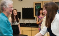 Carol Sheffels (’58) Quigg meets Michaela Burke ’12 and other students who will be using the newly remodeled Louis and Lydia Sheffels Biology Lab.