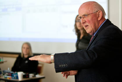 John Amend ’60 explains the use of a spectrophotometer he donated to the PLU Chemistry Department.(Photo by John Froschauer)