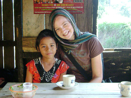 Karissa Bryant sits with a daughter of the Self Help Group member in Umphrew – a village outside of Shillong.