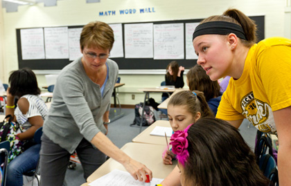 Having PLU students like Castor in her class gives Denis Allen more time to instruct and students an extra person to help them figure out their math problems.