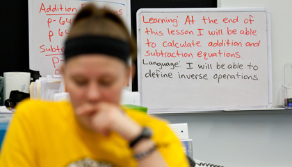 While Castor helps students with finding the area of composite figures, Denise Allen teaches the students about inverse operations.