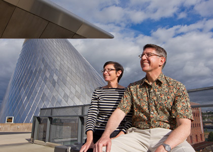 Thomas and Patricia Krise are before the Tacoma Glass Museum.