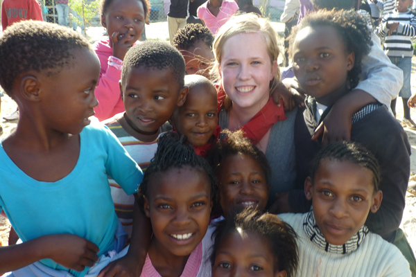 Maryn Johnston ’12 and some of her new young friends in South Africa.