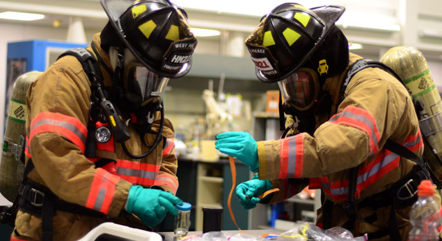 First responders from Central and West Pierce Fire and Rescue ran through a chemical spill response exercise in the Rieke Science Center at PLU. (Photos by Jesse Major ’14)