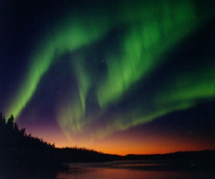 Photograph by Bjorn Anders Nymoen, An aurora over Nesoddtangen, Norway, billows out into the distance on October 9.