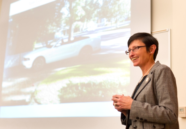 Patricia Krise, Ford Motor executive and wife of PLU President Thomas Krise, talks about pursuing goals and seeking out mentors to a group of MBA students during a State Farm MBA lecture in November. Behind her is the Ford Mustang (of course) driven by her husband. (Photo by John Froschauer)