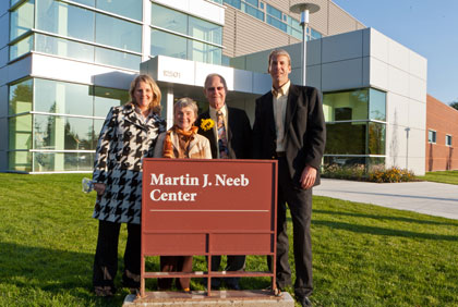 John Korsmo (far right) with Martin J. Neeb and their wives, Lisa Korsmo and Barbara Neeb, in front of the Martin J. Neeb Center home of KPLU.
