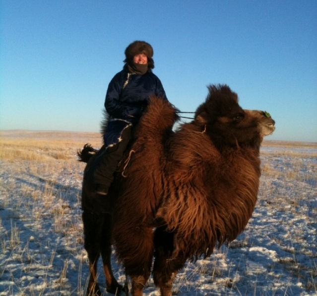 Bonnie Nelson ’08 on top of a bactrian camel in Mongolia. (Photo courtesy of Bonnie Nelson)