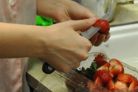 cutting strawberries