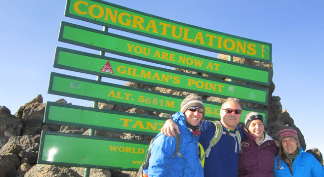 Anthony Markuson ’14, Bill Pursell (Kelsie Leu’s uncle), Anna McCracken ’13, and Leu ’13 summited Mt. Kilimanjaro to celebrate the end of their study away experiences.