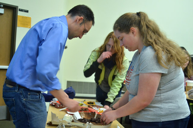 Chemistry professor Justin Lytle, shows students the chemistry of chocolate. (Photo by Jesse Major’14)