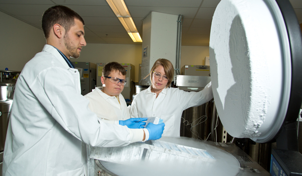 Bryce Manso ’10 with colleagues Tisha Graham ’09 and Julie Williams ’09 at the Fred Hutchinson Cancer Research Center in Seattle, Wash.