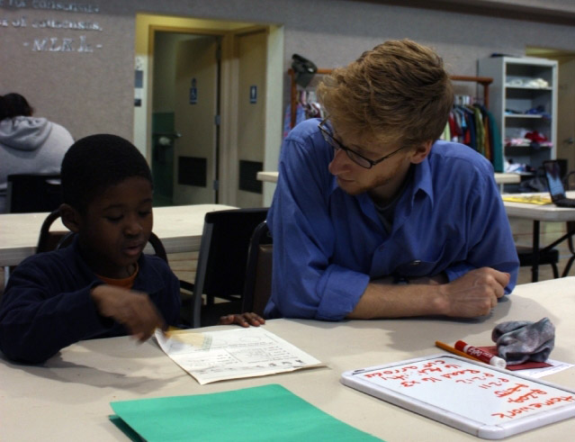 Austin Goble ’09 with a student