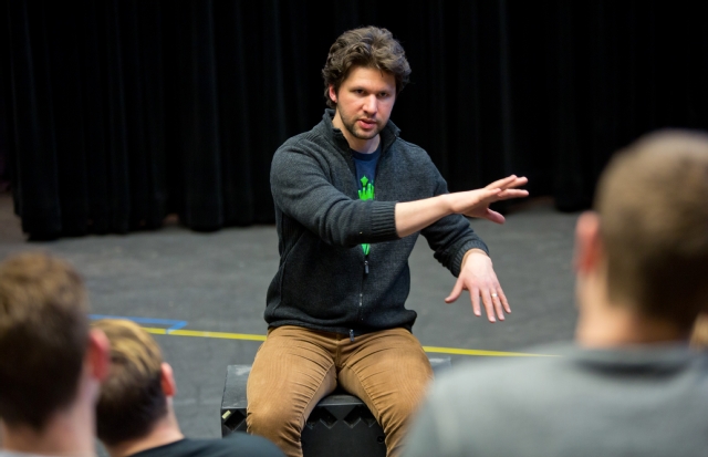 Louis Hobson ’00 talks with theater and voice students at a workshop in January. (Photo by John Froschauer)