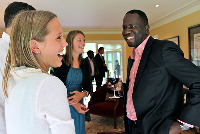 Students talking to Namibian dignitaries at a social event