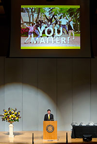 PLU President Thomas W. Krise talking at the Olson Auditorium podium