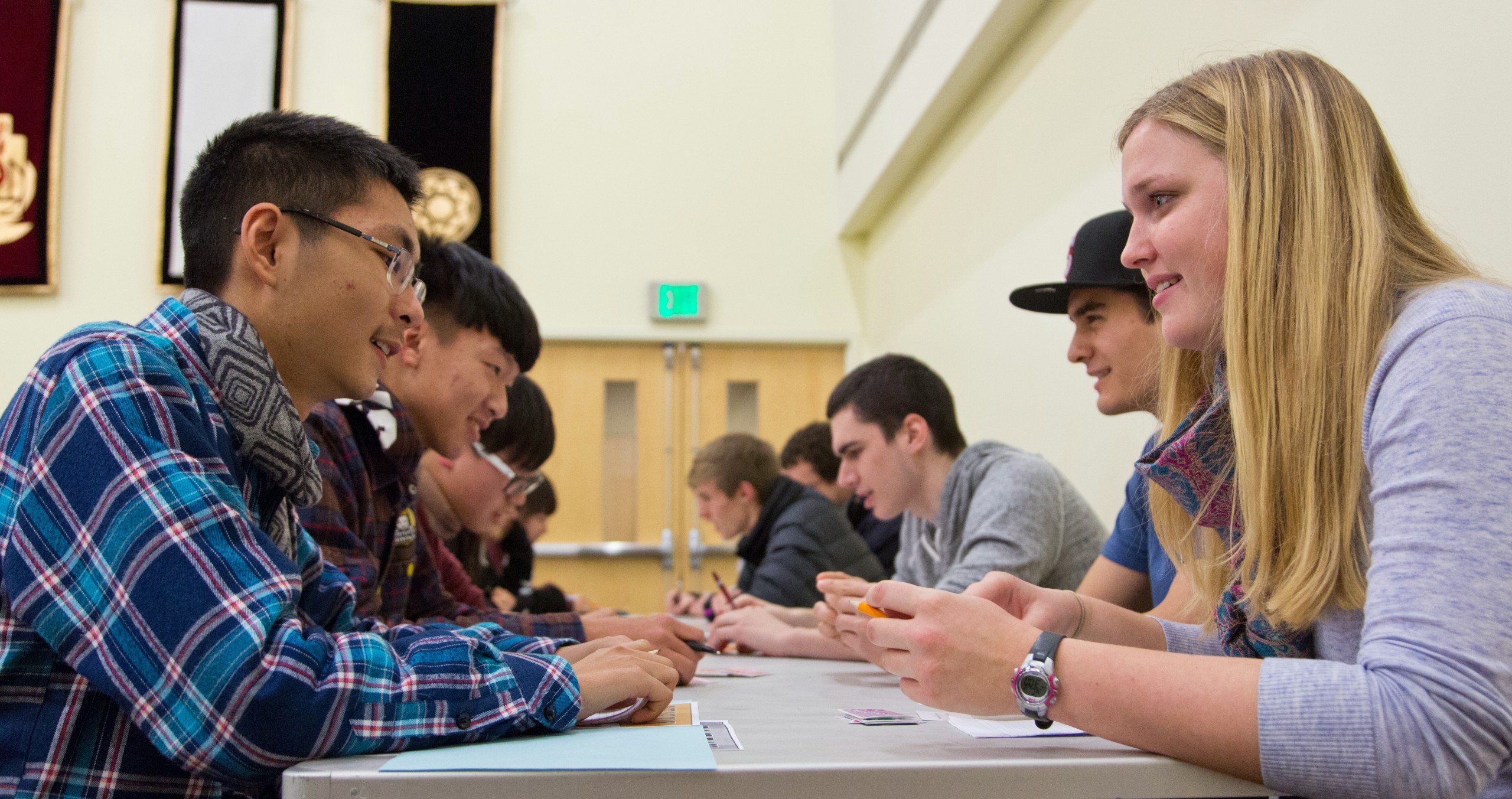Chinese students pair up with Lutes in a “speed-dating” exercise at PLU on Jan. 30 designed to discover cultural intersections. (Photo: John Froschauer / PLU)