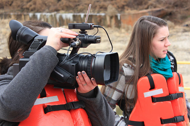 Tapped Out was created by a team that includes Haley Huntington ’14, a Business major; Communication majors Katherine Baumann ’14 and Kortney Scroger ’14; and junior Valery Jorgensen ’15. Two of the students video recording.