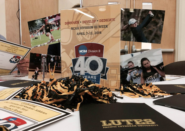 A breakfast on April 10 celebrated student-athletes at PLU. (Photo: PLU Athletics) Photo of a showcase with various sports pics.