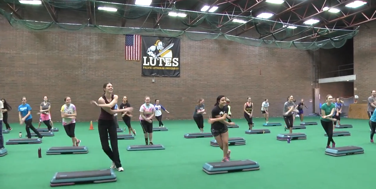Students exercising in the field house.